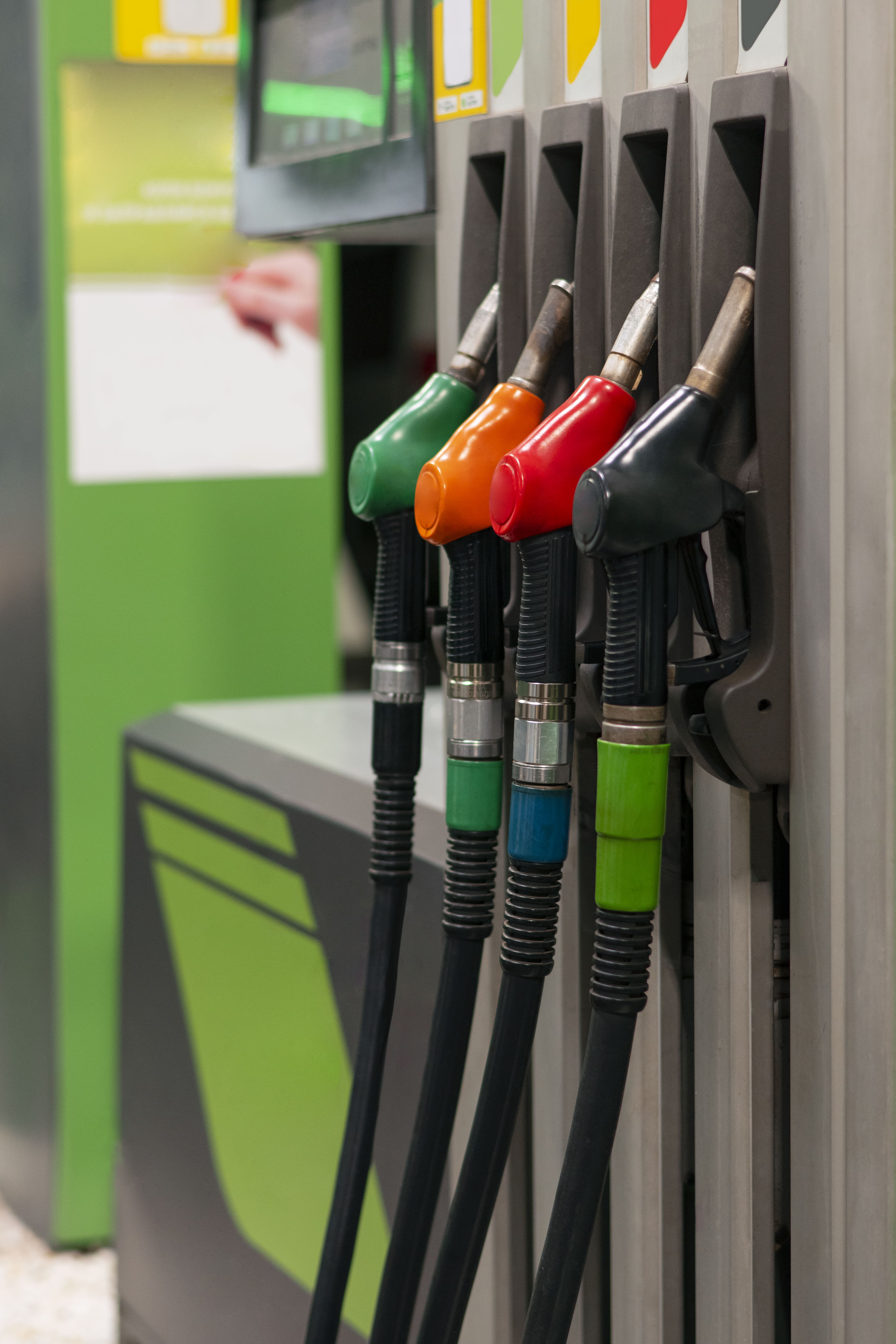 Different colours gas station pumps