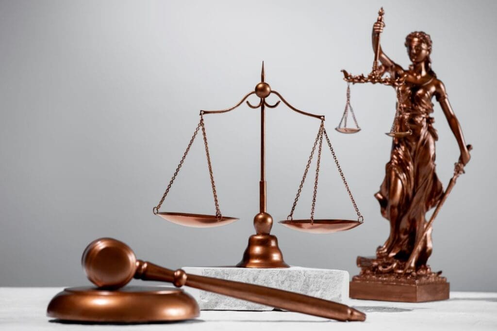 Youths sue Trump over US climate orders Still life with the scales of justice (climate,green justice, Youths sue Trump over US climate orders)