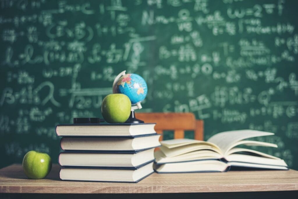 Image: Books with green board background