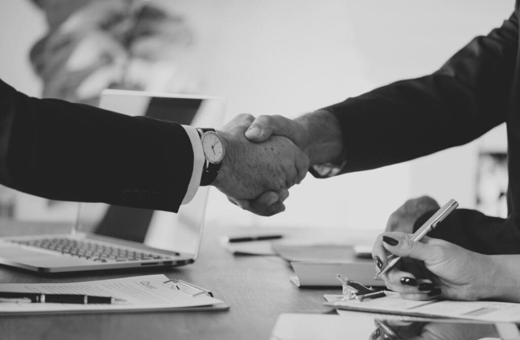 Lingnan University and Friends of the Earth (HK) launch higher education sector’s first Executive Certificate in Sustainable Finance & ESG Analytics business people shaking hands together res