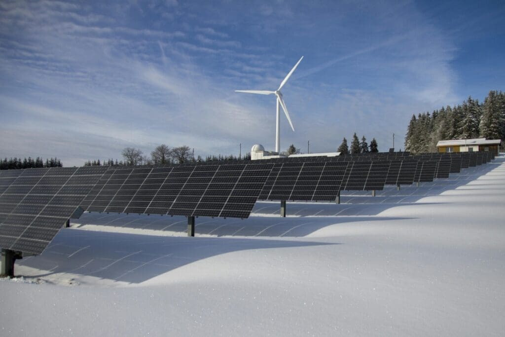 Image: Snow, windmills, solar panels (s. renewables outpace fossil fuels in 2025, climate change) 