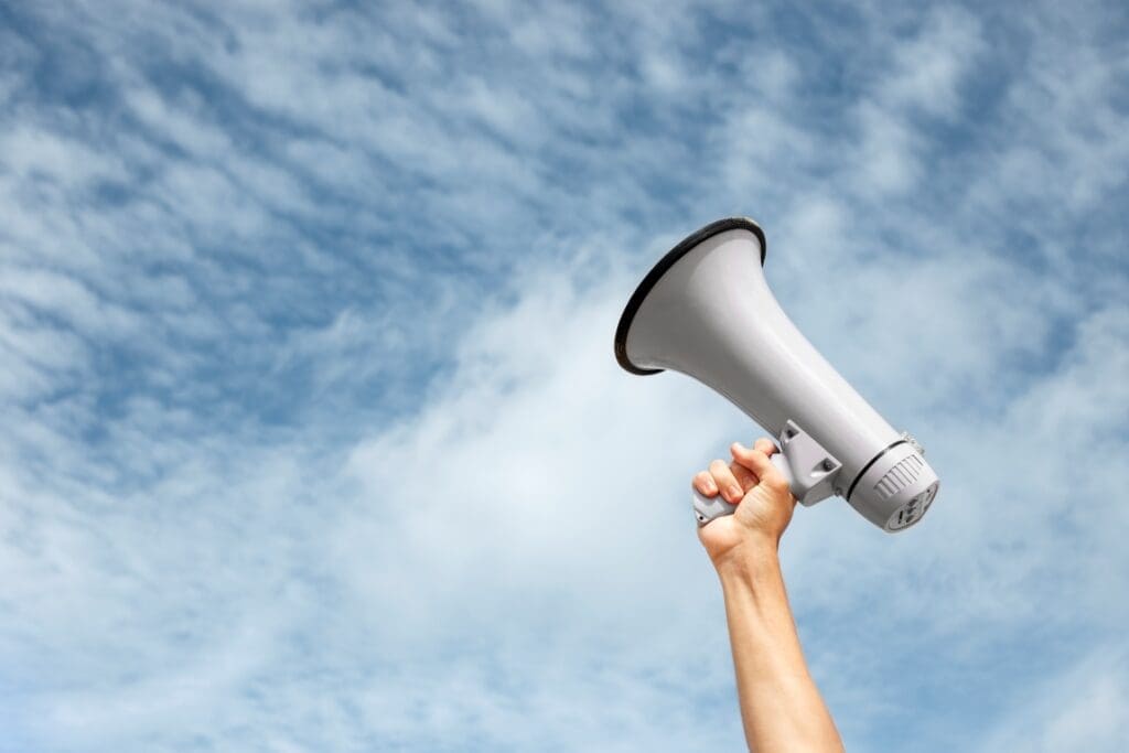 UN Survey: 80% of Global Population Calls for Stronger Government Action on Climate side view hand holding megaphone res