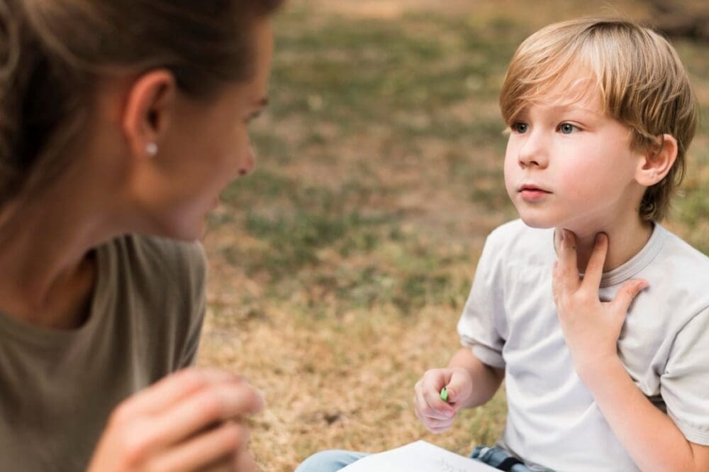 Image: Close-up teacher and boy outdoors