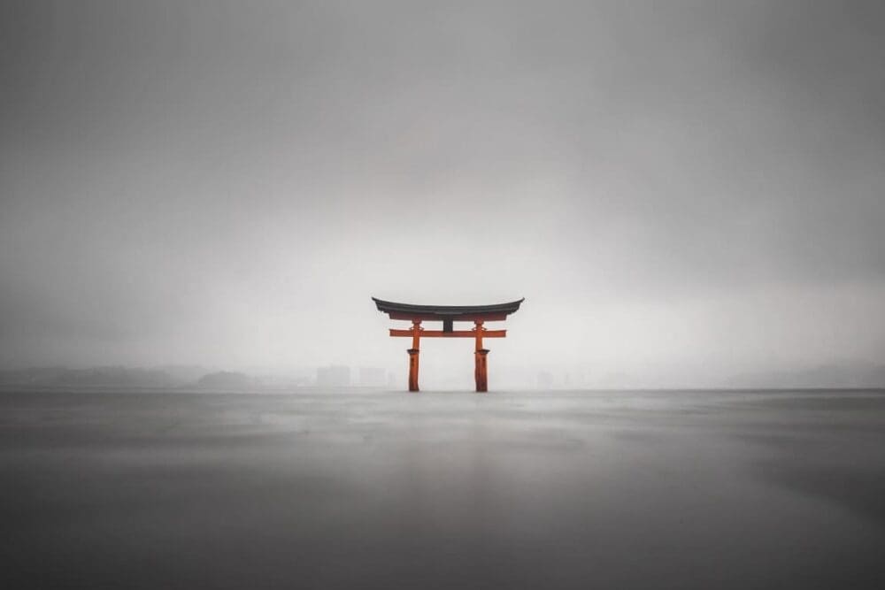 Image: Foggy shot of the floating torii of miyajima, japan during rain