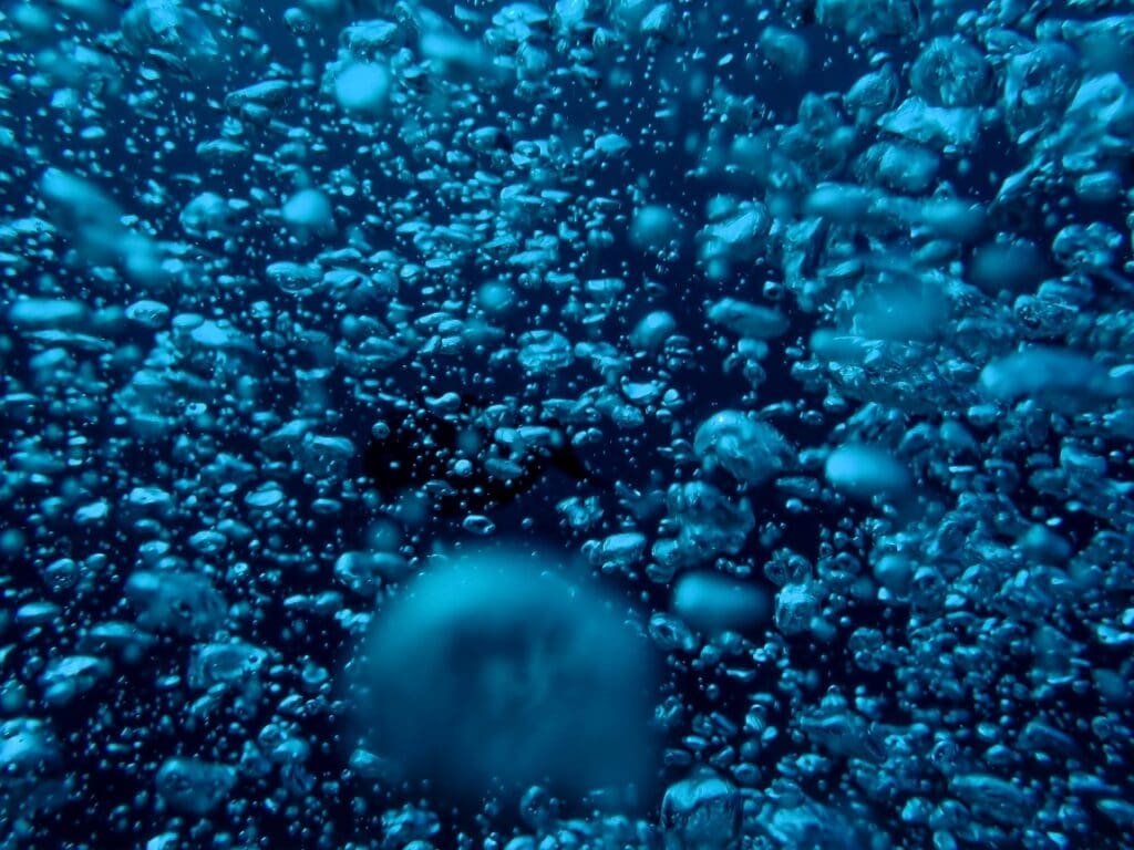 Deep ocean 'dark oxygen' find could rewrite Earth's history Image: blue and white bubbles in water