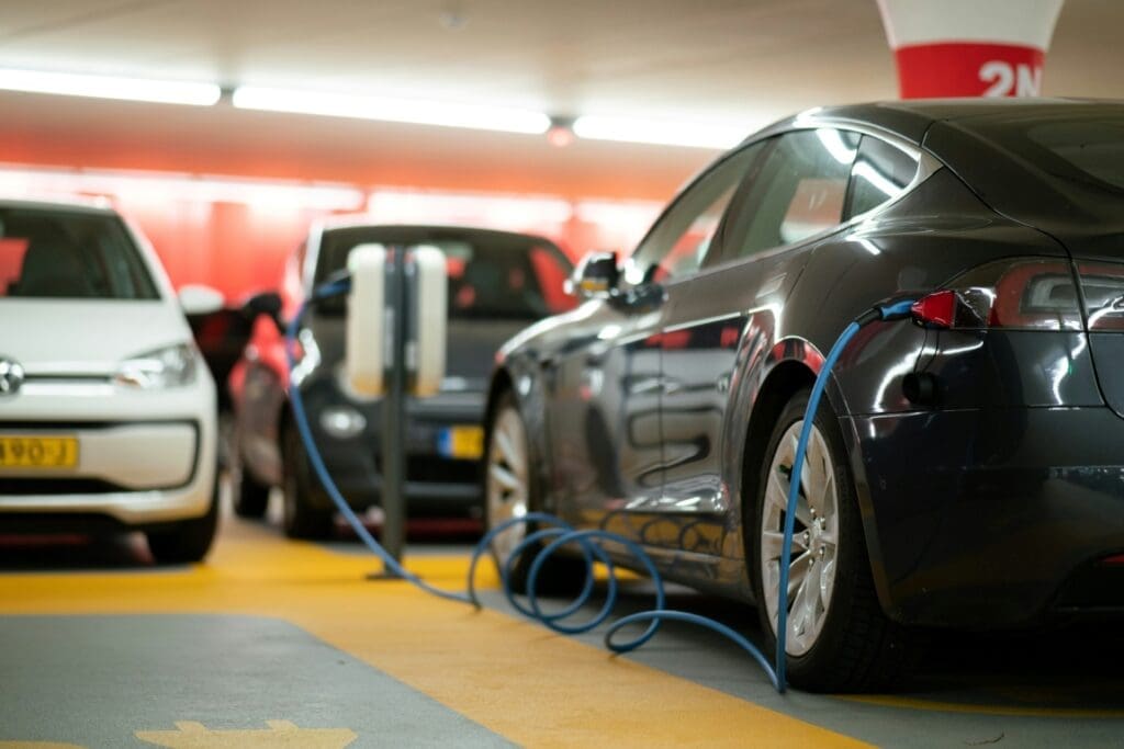EVs alone won't save us from climate catastrophe Image: cars in a parking lot