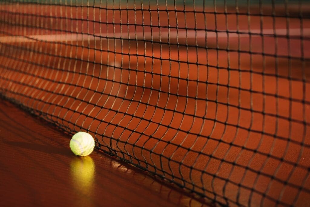 Water stored under artificial turf could make cities cooler and safer to play in tennis ball near tennis net res