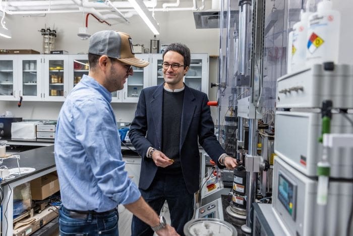 Alessandro Rotta Loria, who led the study, talks with first author Andony Landivar Macias in the lab