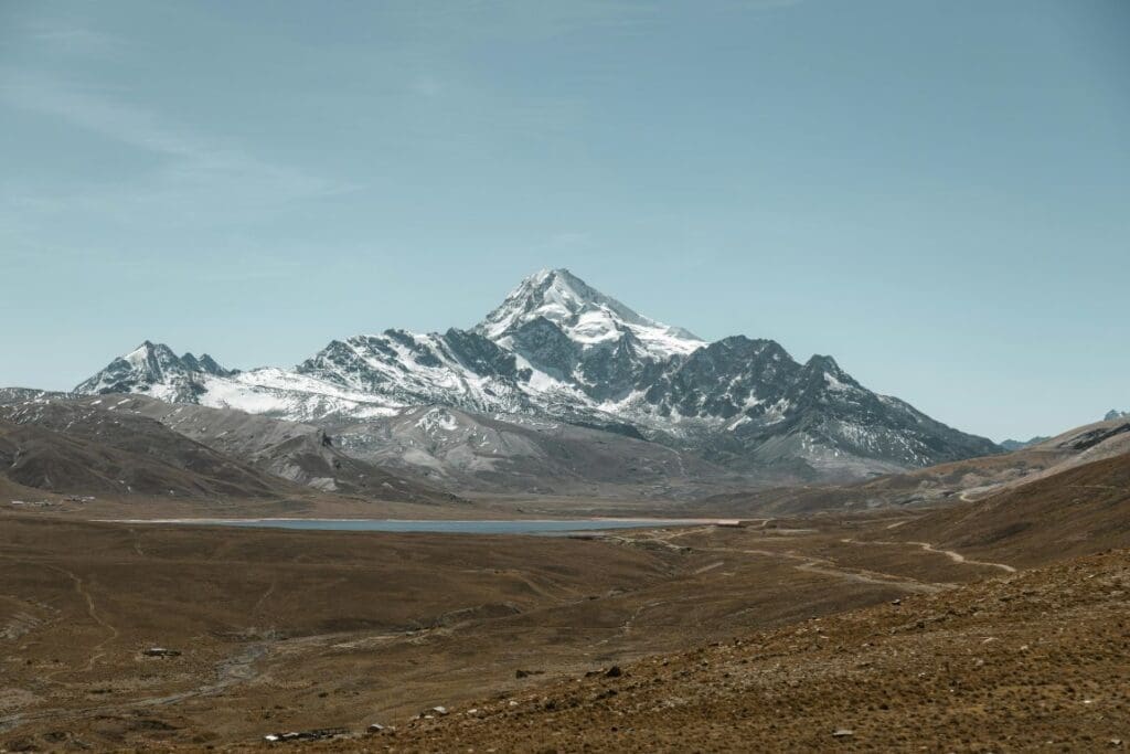 The summit of Huayna Potosí, a mountain near La Paz, Bolivia. Here we find the Zongo glacier, one of several in the tropical Andes Mountains, that are now smaller than at any point since the end of the last ice age 11,700 years ago, according to new research from UW–Madison researchers and their collaborators. (s. climate, global warming)