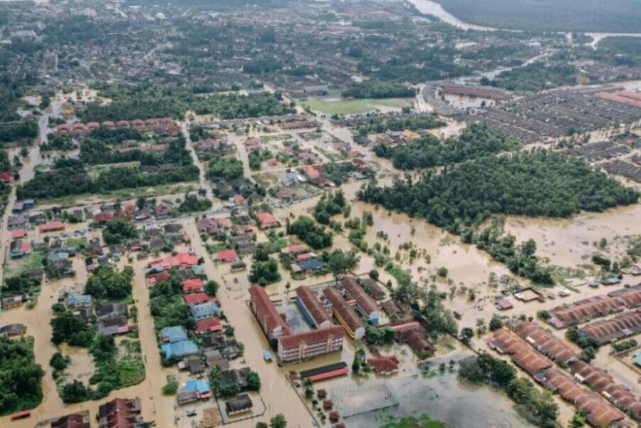 Image: Flooded town with residential buildings and trees