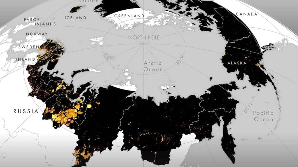 Pan-Arctic light-emitting human activity map showing unlit areas (black) versus lit areas (orange) with significantly increasing (yellow) or decreasing light-emitting human activity (purple) from 1992 to 2013