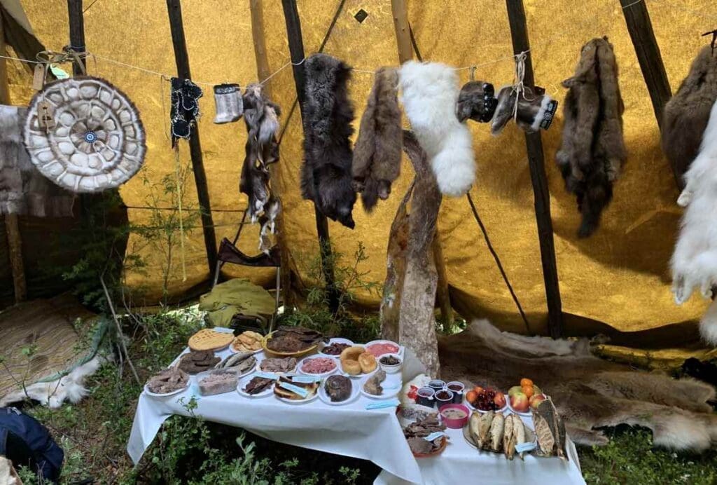 A variety of local traditional foods displayed during a Bakaldyn (celebration) in Kharyalakh, an Evenk settlement of the Arctic region
