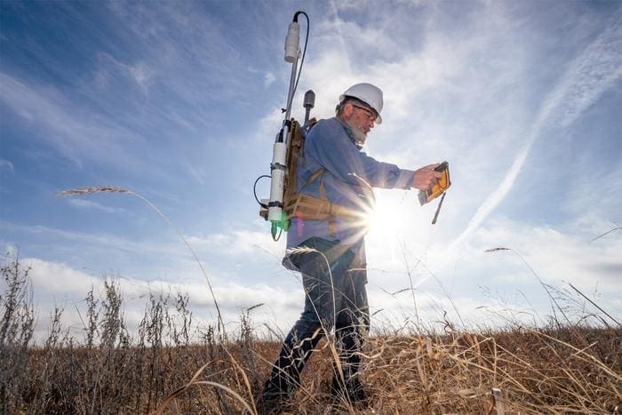 Image: Berkeley Lab scientist Sebastien Biraud leads the field team of researchers looking for lost wells. He carries a backpack-mounted sensor to measure magnetic fields, which can help find the buried metal structure of a well casing
