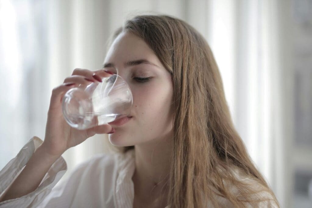Woman Drinking Water (s. forever chemicals scandal)