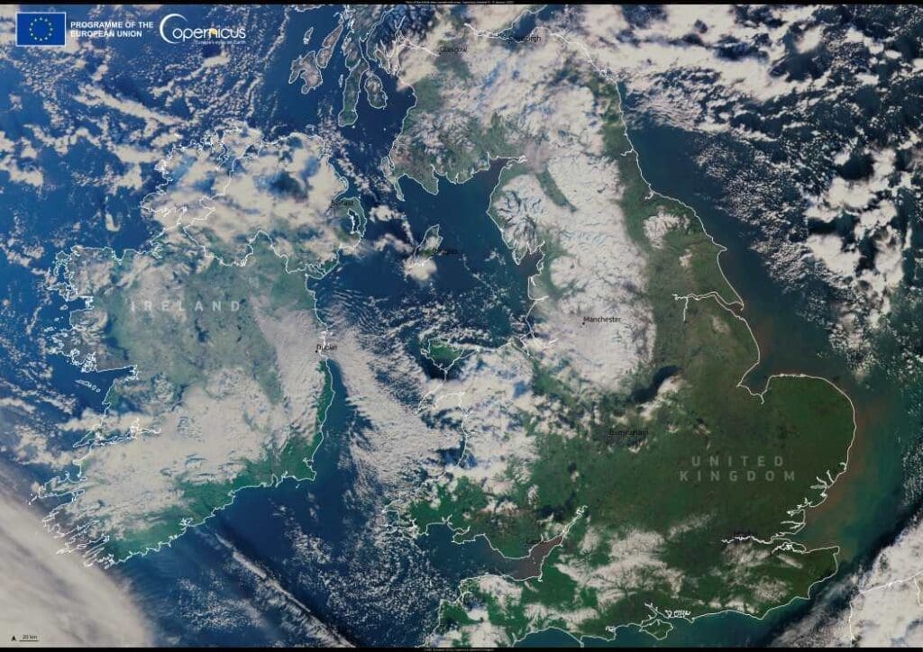 Satellite image showing snow covering parts of the British Isles is visible.