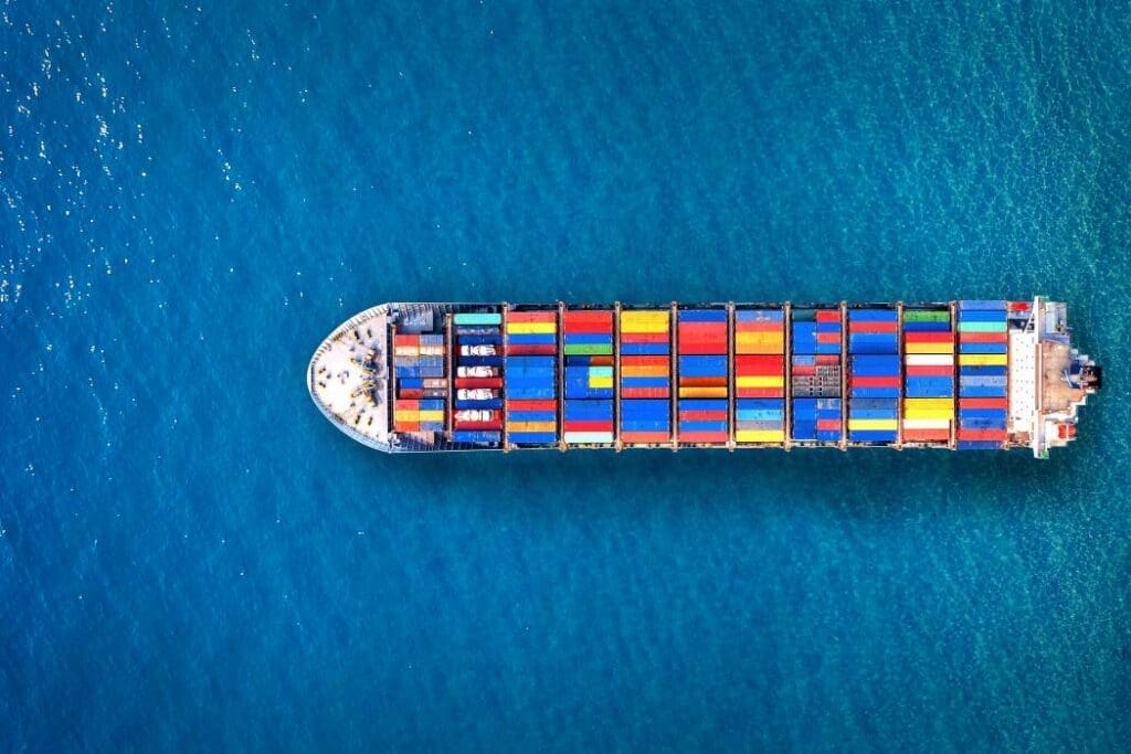 Aerial view of container cargo ship in sea - shipping emissions