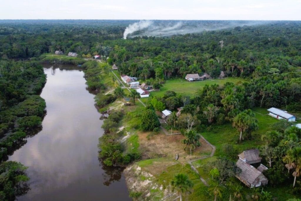 An aerial view of a remote village in the Pastaza-Marañón Foreland Basin of the Amazon