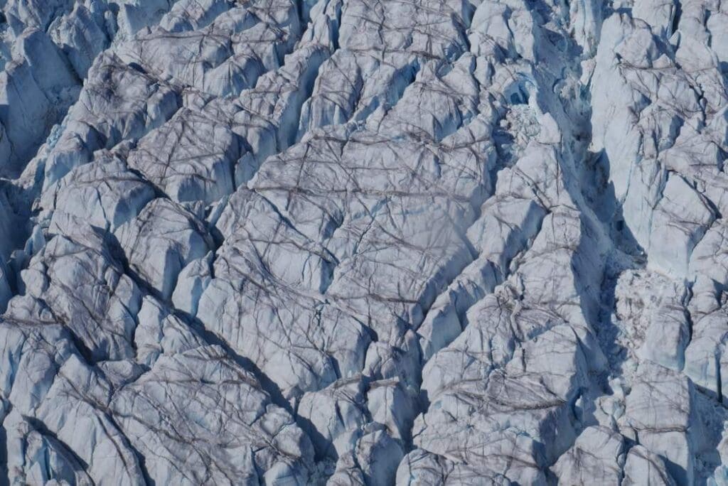Greenland's ice is cracking faster as climate change accelerates glacier flow Image: Crevasses at Store Glacier, a marine-terminating outlet glacier of the western Greenland Ice Sheet
