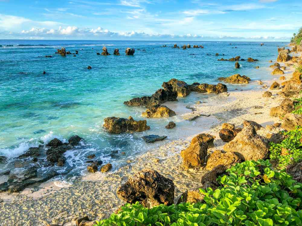 Nauru sells citizenship to fund climate change mitigation Image: Beach coast, Nauru (s. climate change, climate financing)