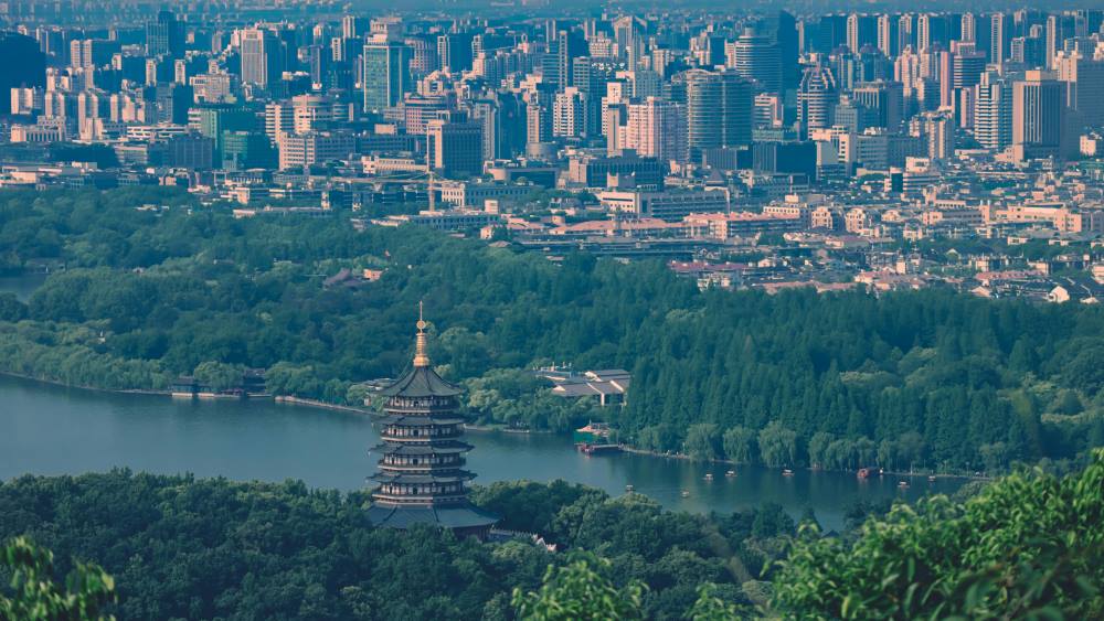 Aerial view: Hangzhou, China - Cityscape with River and Pagoda (s. climate. science)