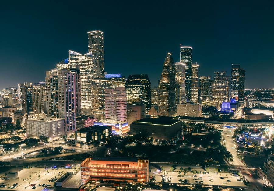 Climate Science Digest: February 21, 2025 Image: Night Cityscape with Illuminated Skyscrapers (Houston, USA) (s. climate, science)