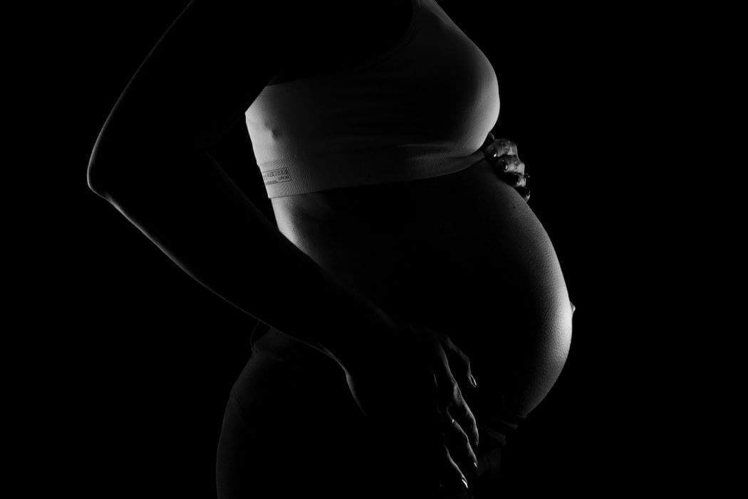Gray scale Photo of a Pregnant Woman (s.climate, pollution, pregnancy)