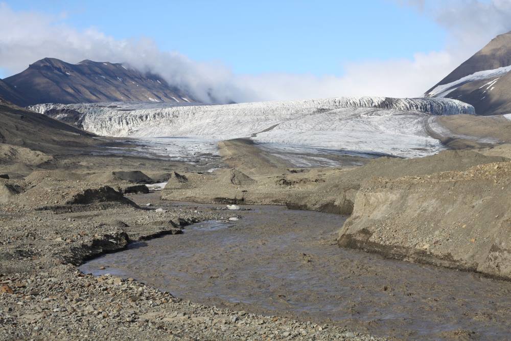 Image: Melt river flows from the terminus of Vallåkrabreen, Svalbard