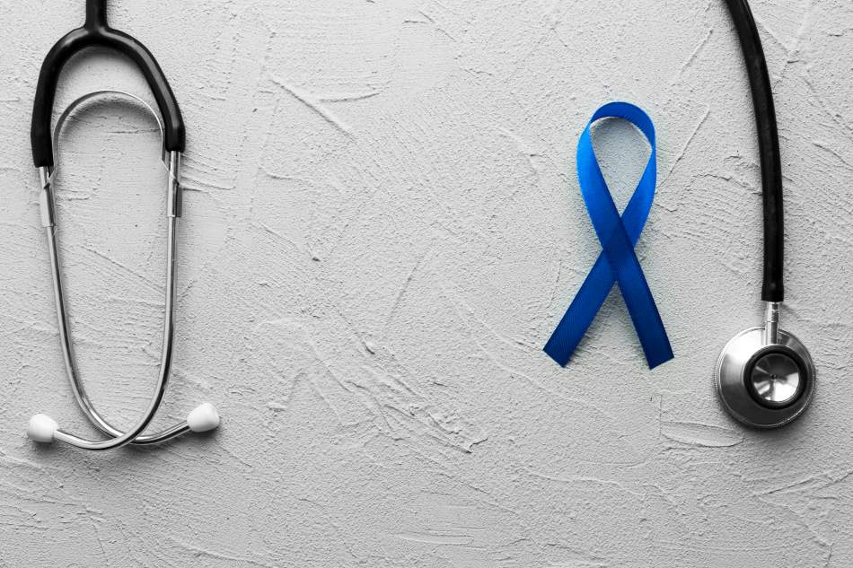 Disasters linked to delays in colorectal cancer diagnoses Image: Black stethoscope and blue ribbon on plaster (s. cancer diagnoses)