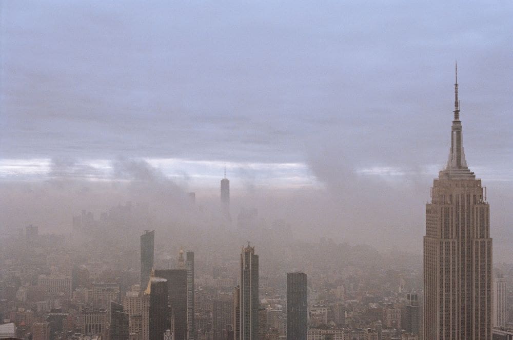 Trump admin cuts 'mean more dirty air': advocacy group Image: Aerial view of a city with a lot of tall buildings (s. air pollution)