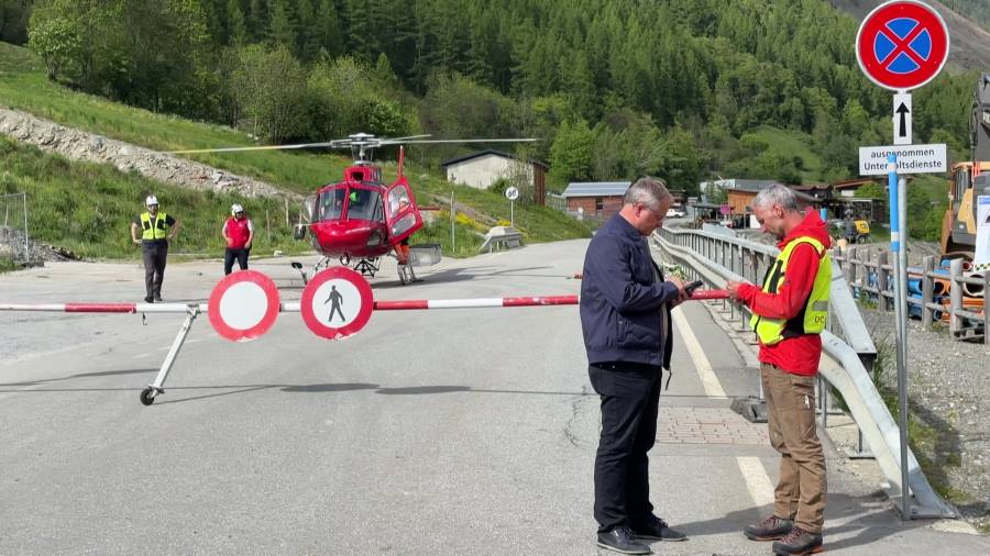 Image: An ambulance takes off from the village of Wiler as the response continues to a glacier collapse which destroyed the village of Blatten in Switzerland. As a precaution, 16 people were evacuated from the villages of Wiler and Kippel, located downstream from the disaster area in the Loetschental valley. (s. flood monitoring, climate change, glacier)