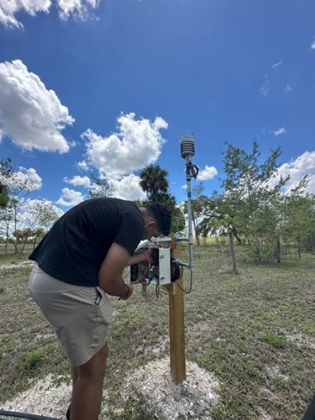Storm ready: FAU Sensing Institute’s weather network delivers real-time forecasting Image: Nicholas Alberto, a student at FAU I-SENSE, completes a recent installation of an atmospheric station in Florida