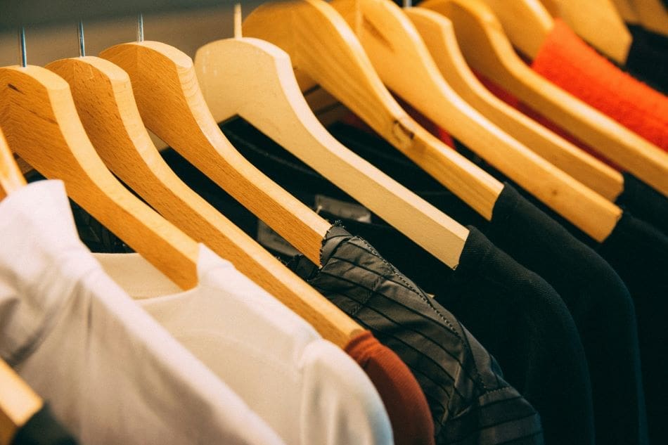 Italy fines fast-fashion giant Shein for 'green' claims Image: clothes hanged on brown wooden hanger