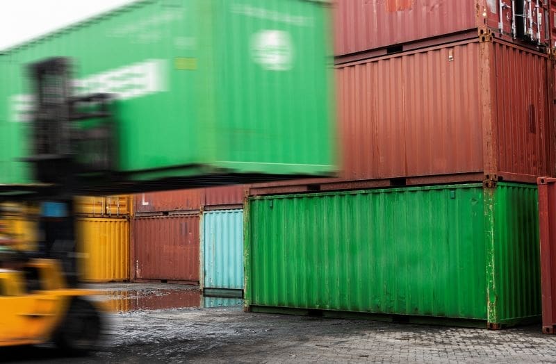 Image: Forklift unloading a container box (s. hazardous waste)