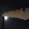 Study links major polluters to big climate damages bill Image: a smokestack emits from a chimney at night
