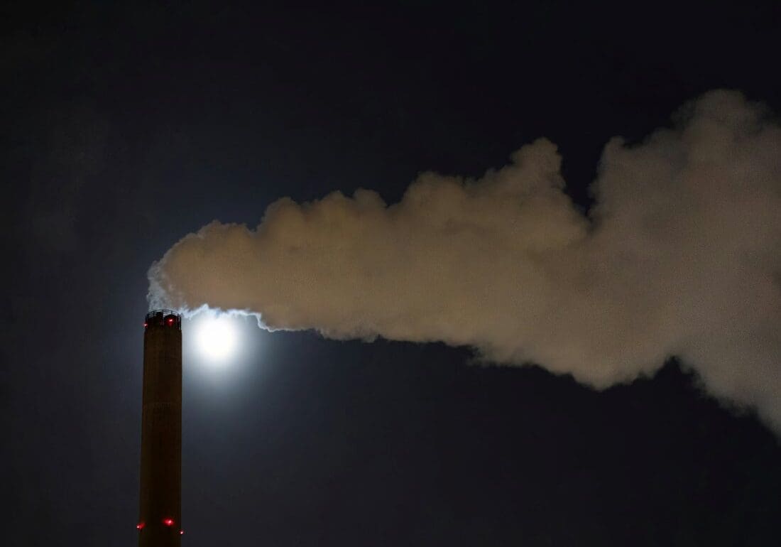 Study links major polluters to big climate damages bill Image: a smokestack emits from a chimney at night