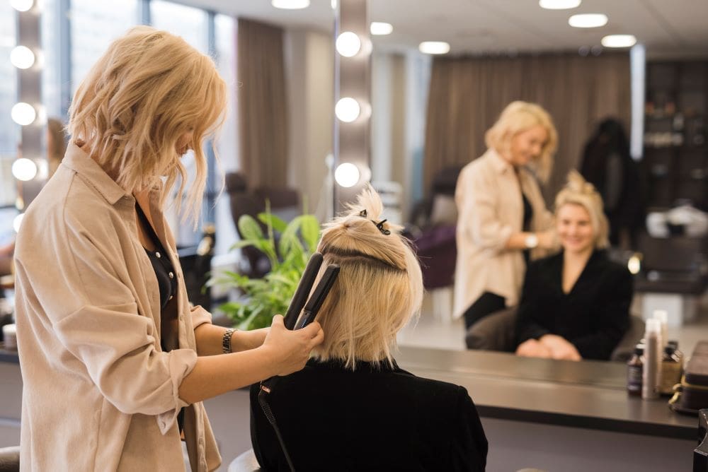 Hairdressers seen as ‘everyday influencers’ in climate action study Image: Blonde girl getting her hair done