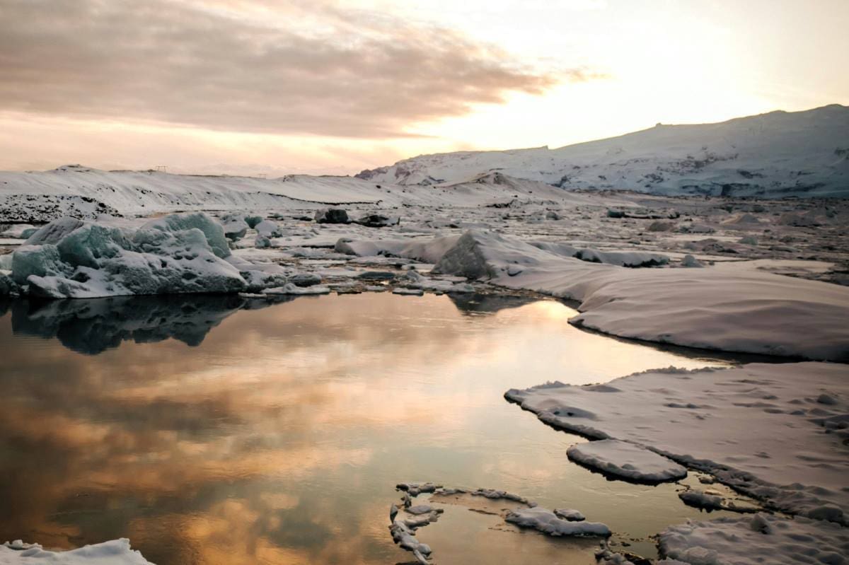 Image: Scenic View of a Snow Covered Landscape (s. pond, Arctic, clouds)