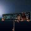 Image: a democracy burning neon sign