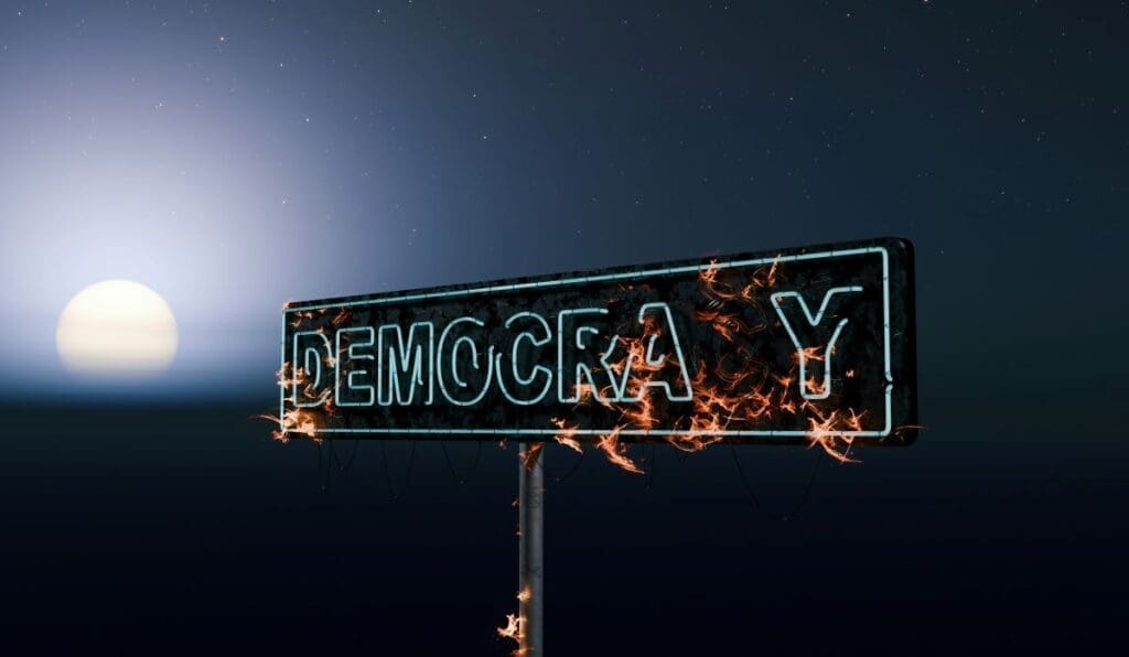 Image: a democracy burning neon sign