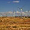 Image: White Windmills Under a Blue Sky - Eaglesham, Scotland, United Kingdom (s. clean energy)
