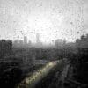 Image: a view of a city through a rain covered window