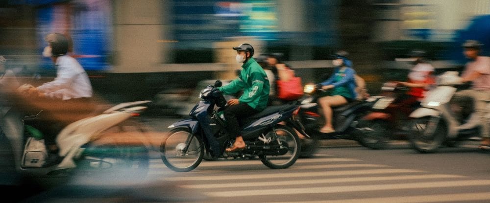 Hanoi hits the brakes on petrol bike ban Image: Motorbikes are speeding through a Hanoi intersection