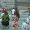 Heat dome over Europe scorches UK, Ireland, France and Spain Image: People cool off beside the Trocadéro fountains in Paris during a hot summer day