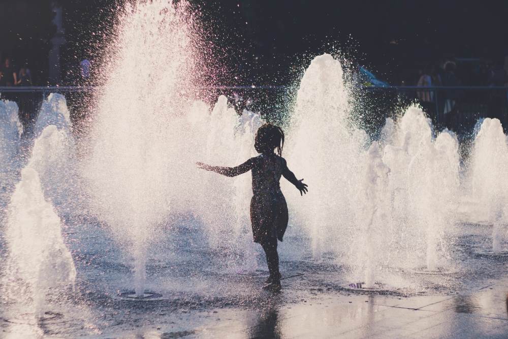 Europe sweats through new heatwave, with worse to come Image: girl cools off in a water fountain