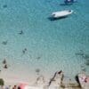 Image: a group of people swimming in a body of water
