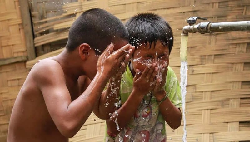 Climate Science Digest: June 9, 2026 Image: Children cooling off with piped water in Khan Village, Lao PDR in 2015