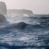 Image: sea waves crashing over rock formations (s. storm)
