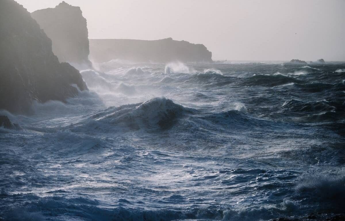 Image: sea waves crashing over rock formations (s. storm)