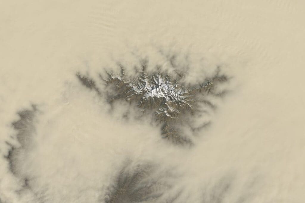 Intense sand and dust storms struck China, US in 2025: UN Satellite Image: On March 27, 2025, Landsat 8's Operational Land Imager (OLI) captured a break in the dust cloud over the southern Tarim Basin, briefly revealing the snow-covered peaks of the Tekilik Shan as a powerful spring dust storm swept across western China