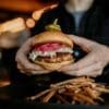 Young people lead dietary emissions as seniors drive the rise Image: a person holding a burger